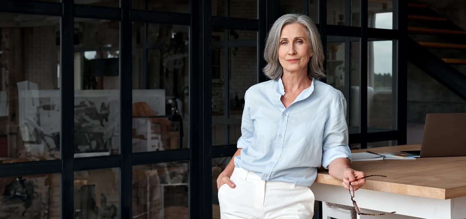 student posing in office